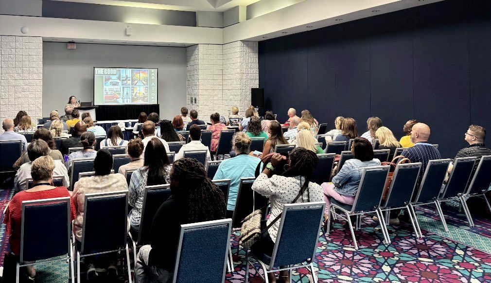 Charlsie presenting her AI session to a full room at AETC 2024